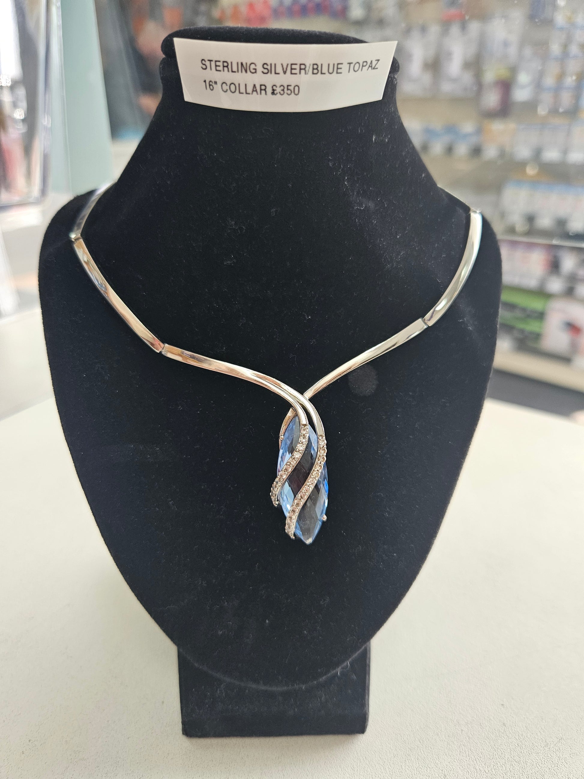 Sterling silver, blue topaz and cz collar